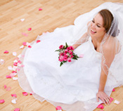 happy bride holding flowers on her wedding day