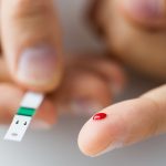 Diabetic checking blood-sugar levels