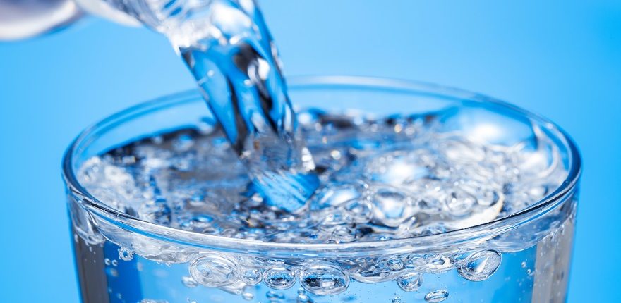 pouring a glass of sparkling water